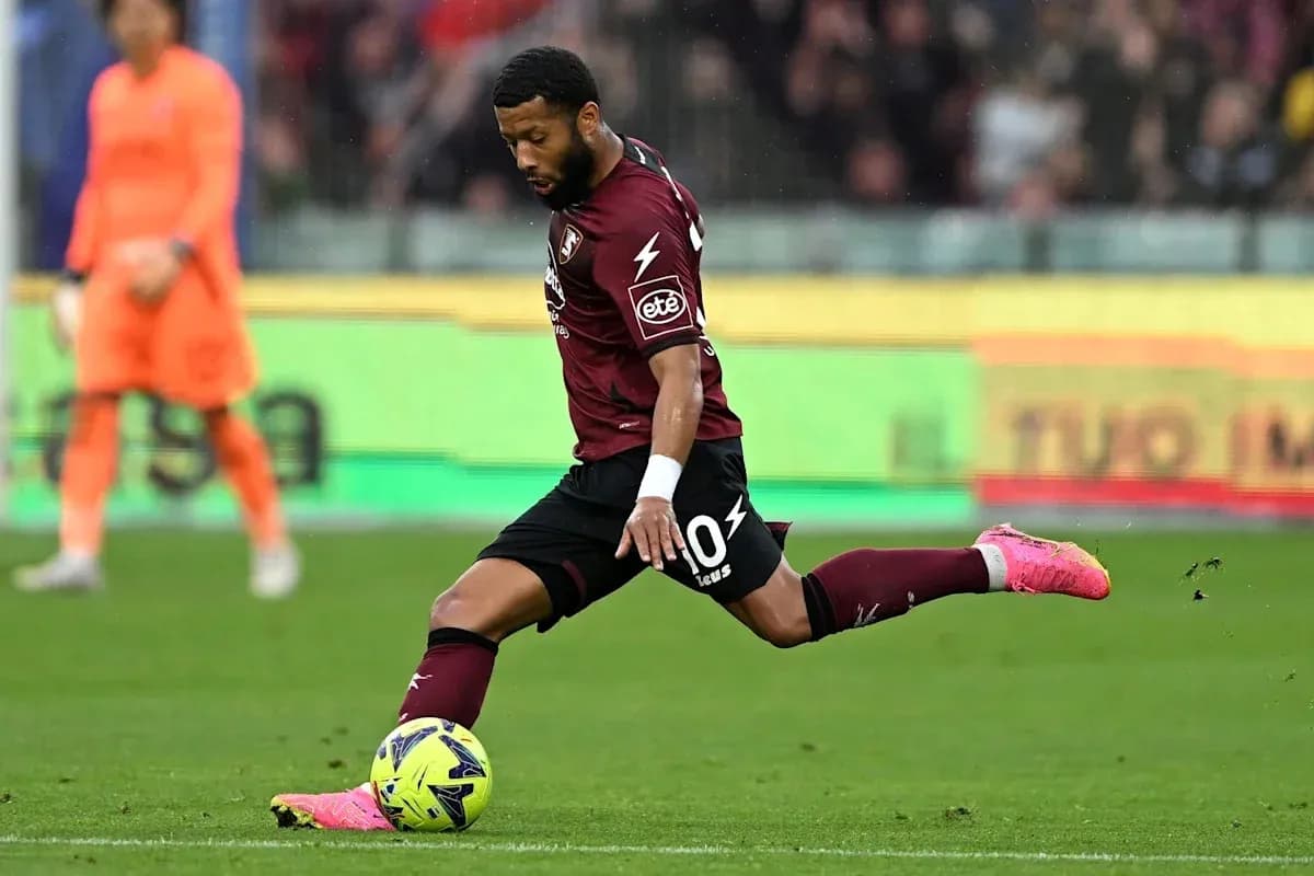 Player kicking a soccer ball during a match