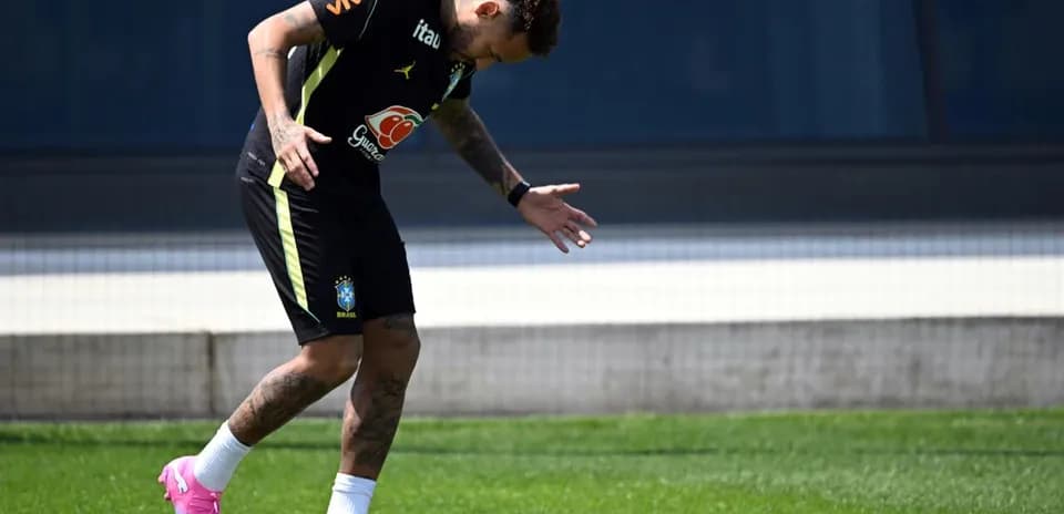 Player training on the pitch in Brazil kit