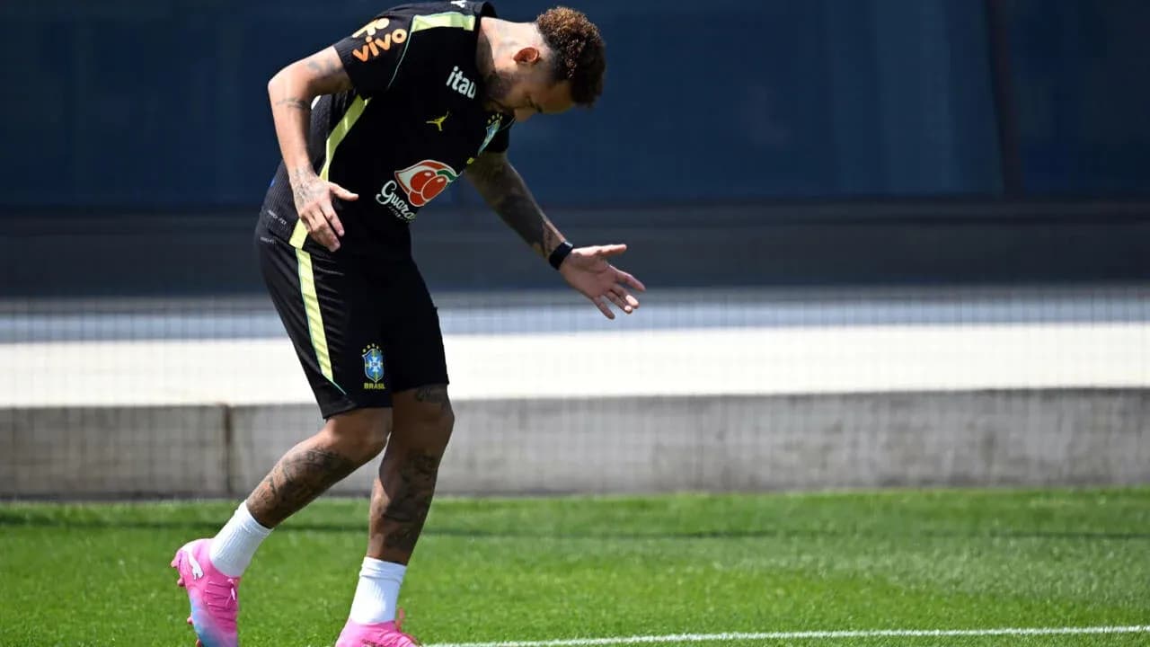 Player training on the pitch in Brazil kit