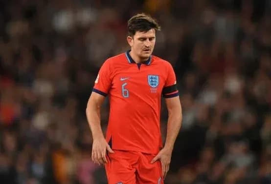 Player in red England kit during match