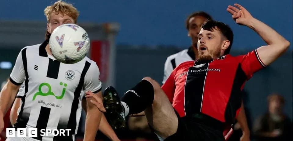 Player kicking ball during a competitive match