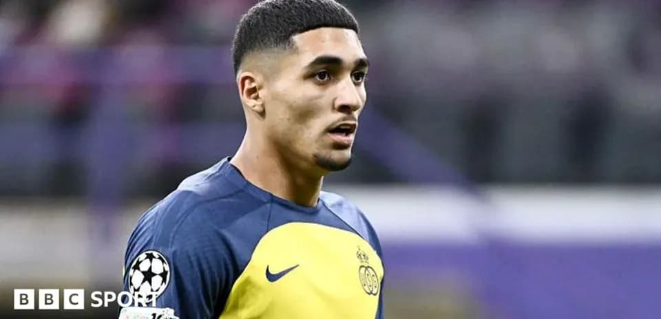 Player in training kit during a match warm-up