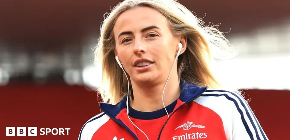 Player wearing headphones walking on the pitch