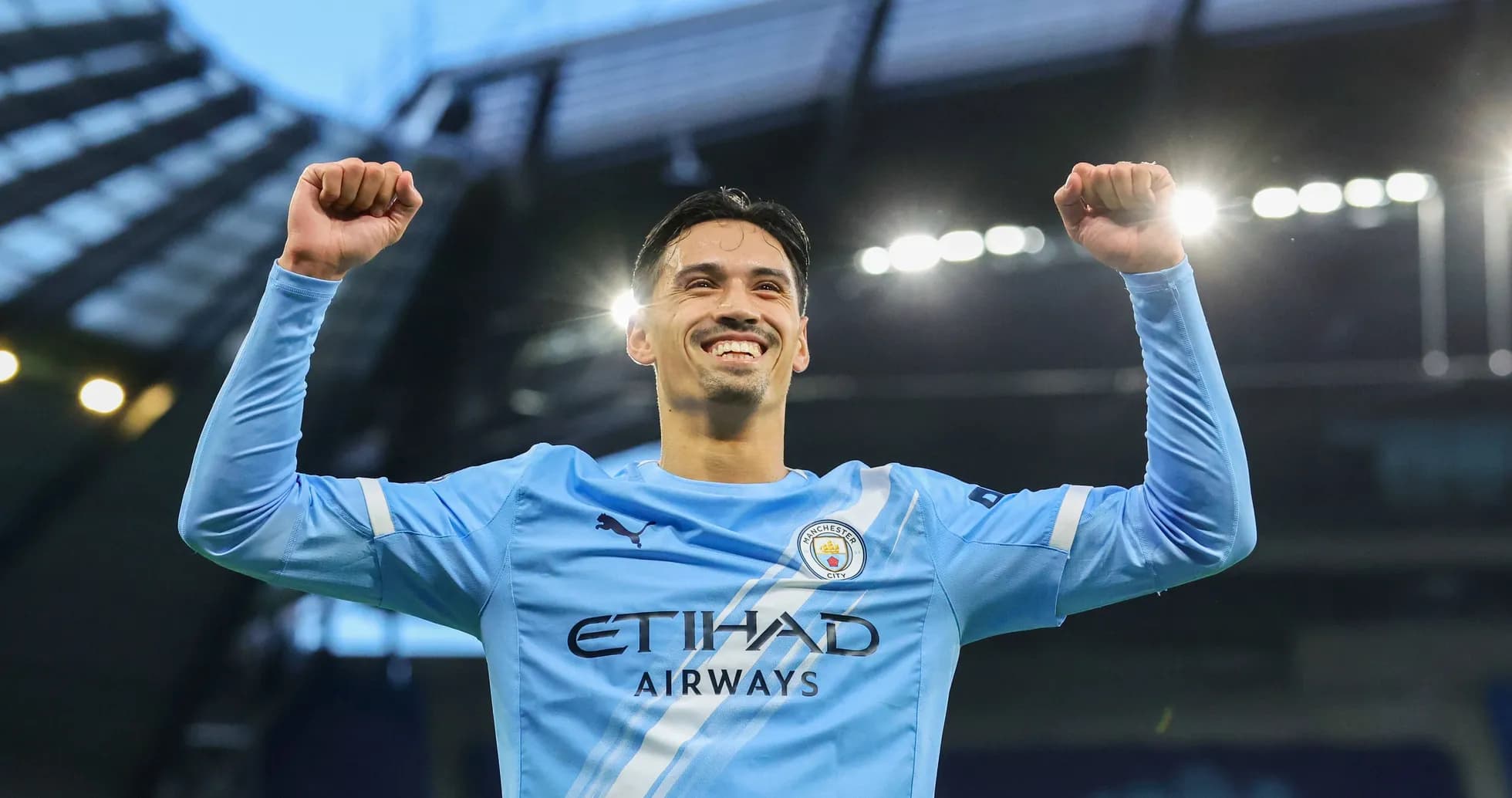 Player celebrating in Manchester City jersey