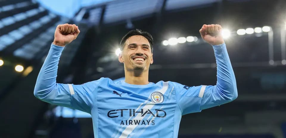 Player celebrating in Manchester City jersey