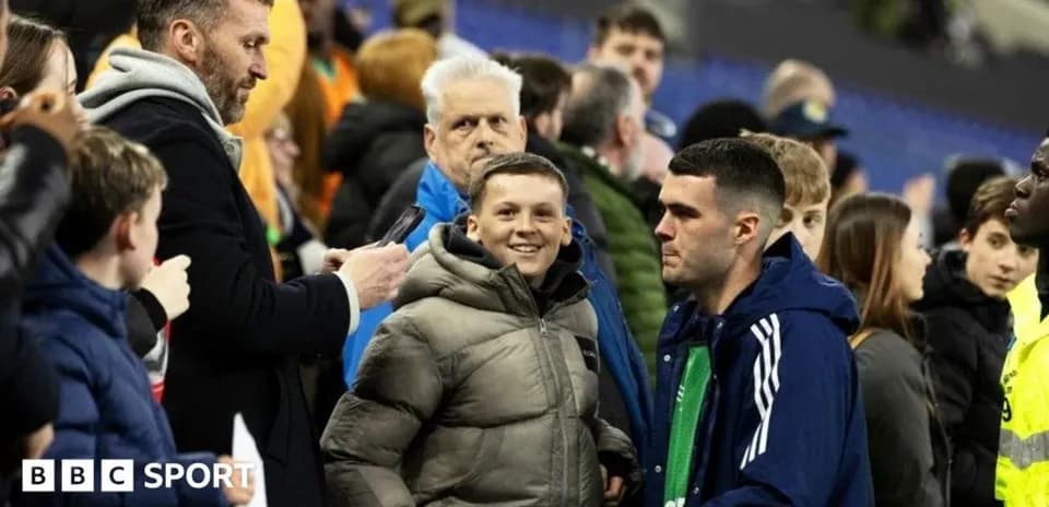 Fans interacting in the stands at a match