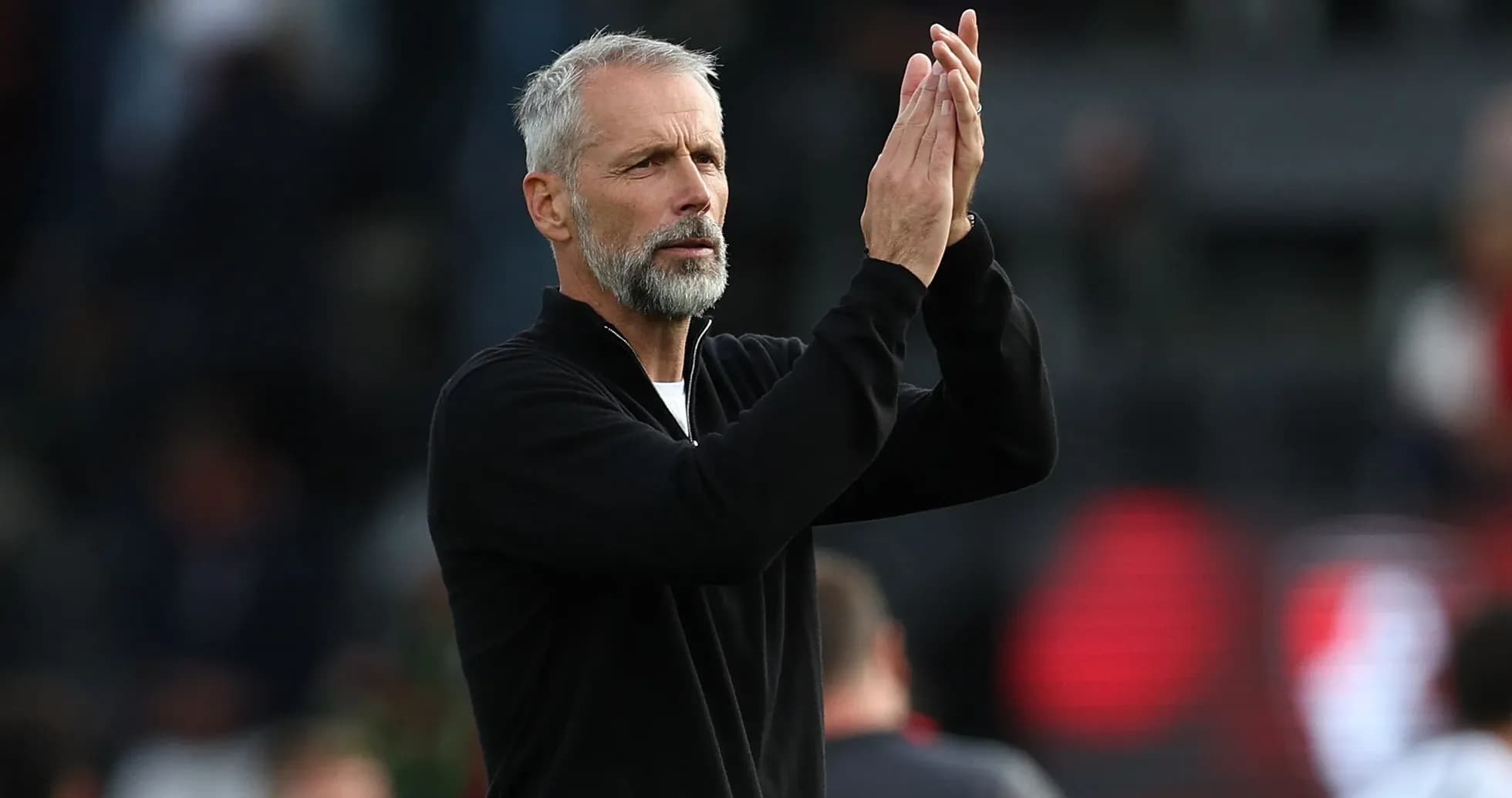 Coach applauding during a match or training session