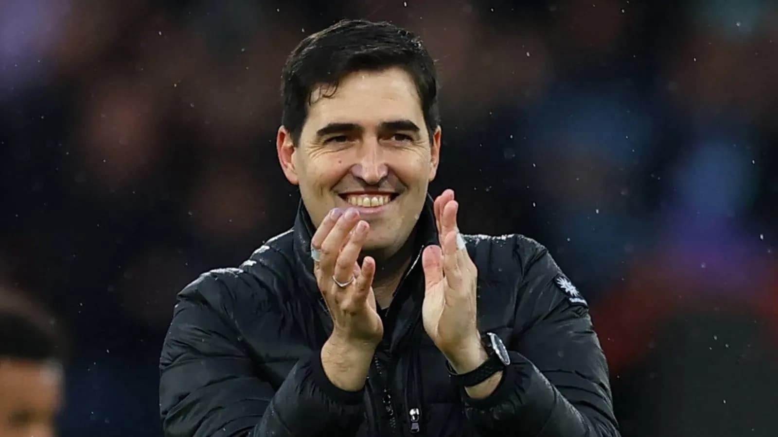 Coach applauding during a match celebration