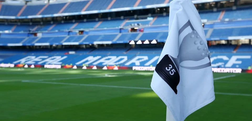 Corner flag in front of empty stadium seats