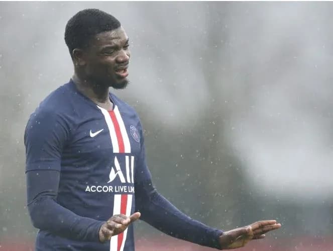 Player gesturing during training in rainy weather