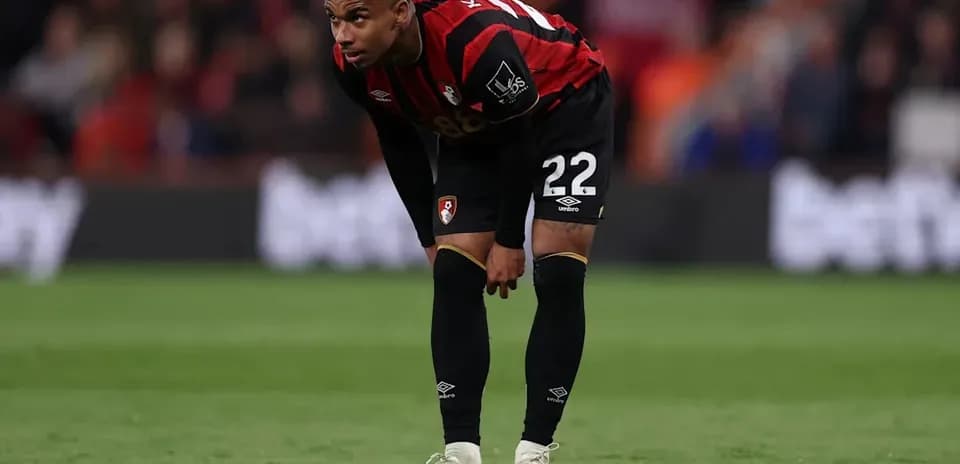 Bournemouth player bending over during match