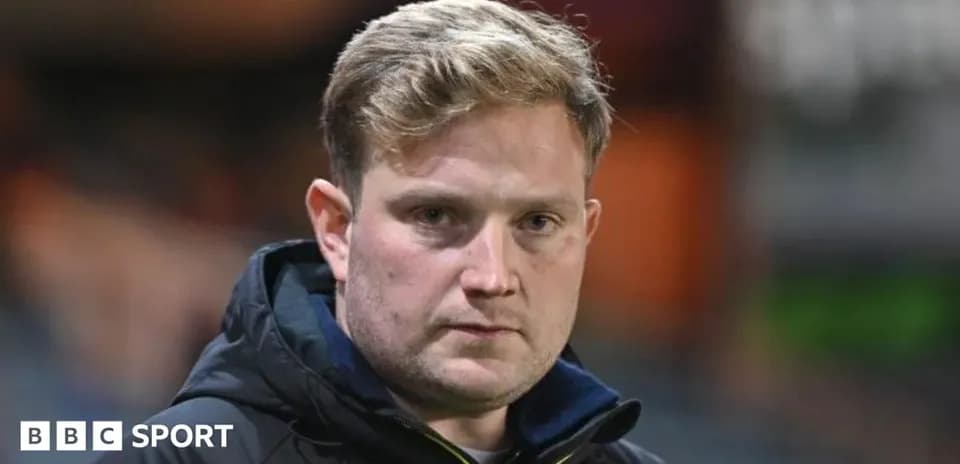 Coach looking intently during a match