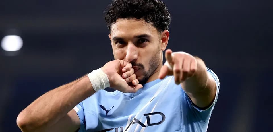 Player celebrating and pointing after scoring a goal