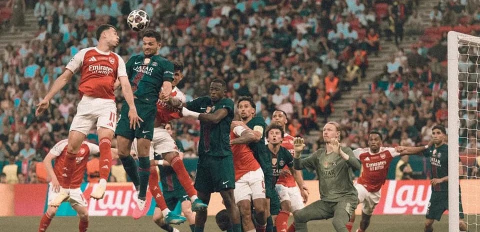 Players contesting a corner kick in football match