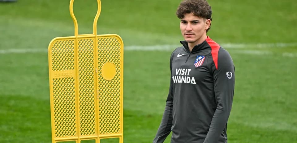 Player standing near training equipment at practice
