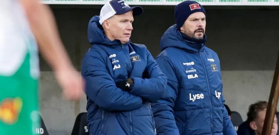 Coaches observing the match from the sidelines