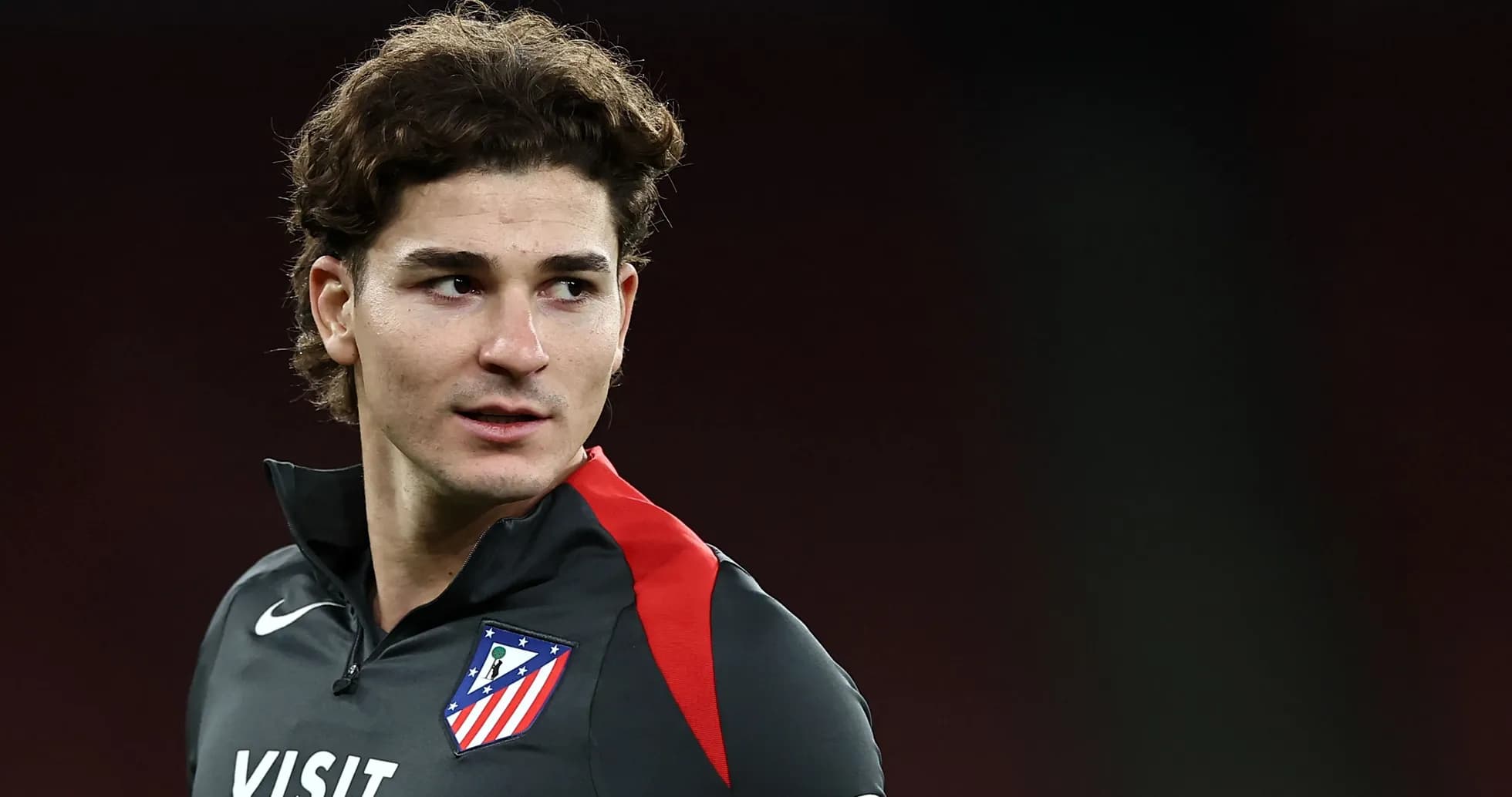 Player in Atlético Madrid training kit during session