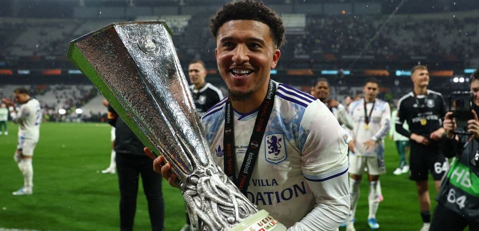 Player celebrating with trophy after match victory