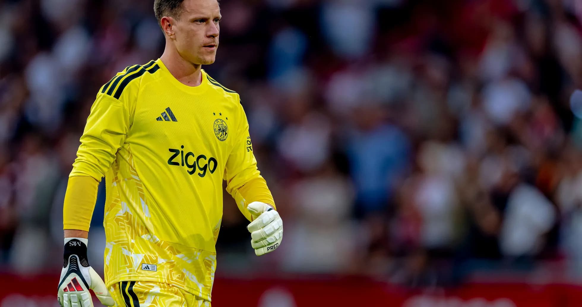 Goalkeeper in yellow kit during match