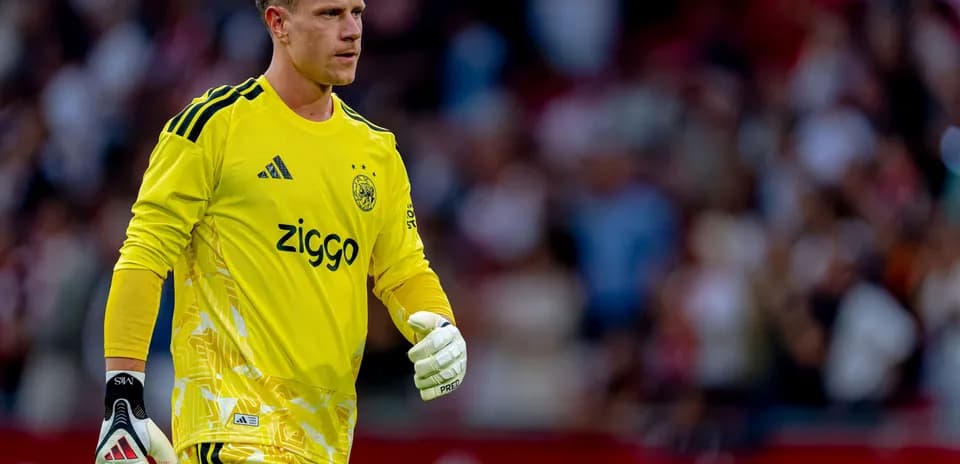 Goalkeeper in yellow kit during match