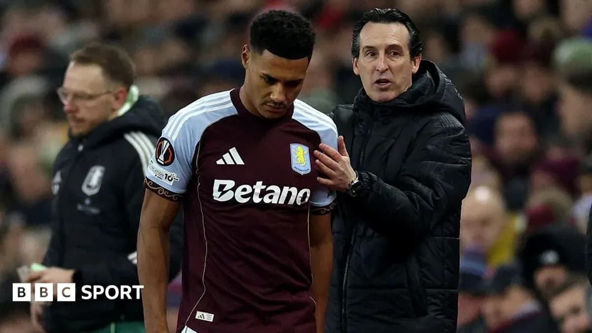 Aston Villa player receiving instructions from coach