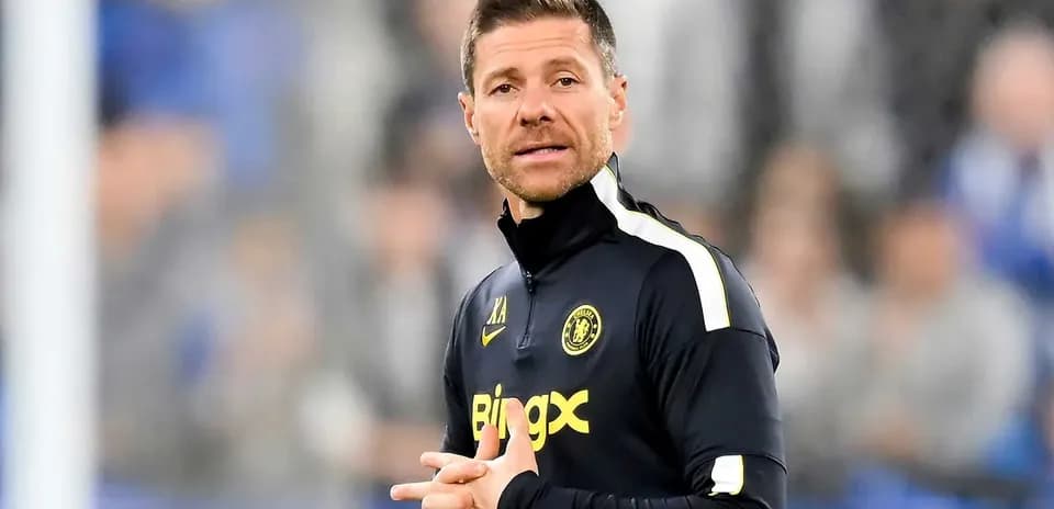 Coach wearing team jacket during match warm-up