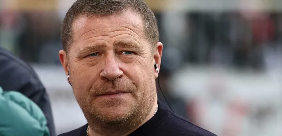 Man wearing earphones, looking intently at event