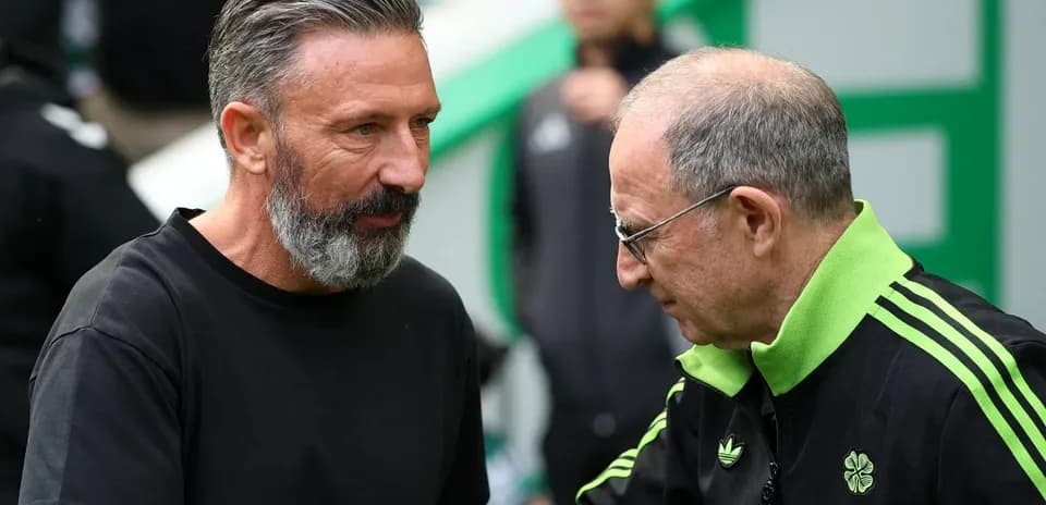 Two football managers shaking hands before the match