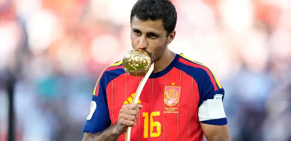 Player kissing trophy after winning match