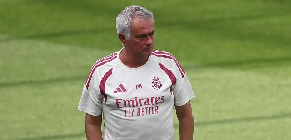 Coach walking on the training pitch in Madrid