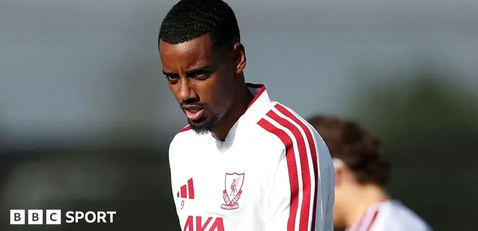 Player training in white jersey with red stripes