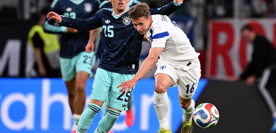Player from Finland challenged by German opponent during match