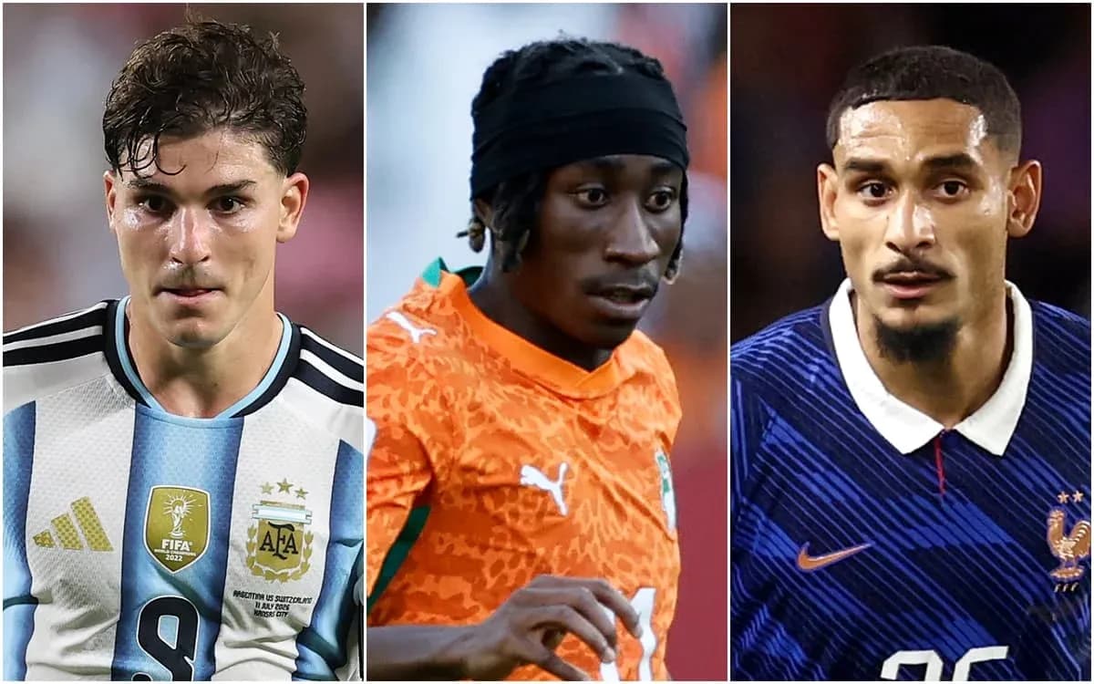 Three football players in their national team jerseys