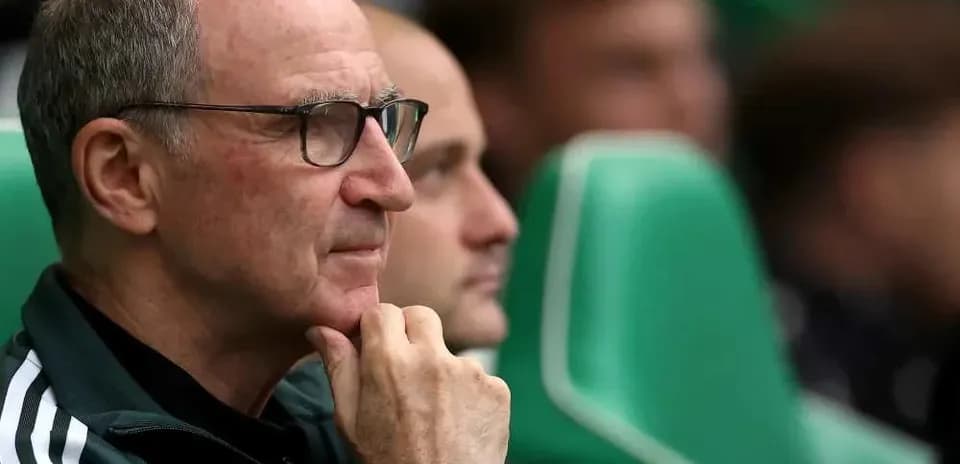 Coach observing from the sidelines during match