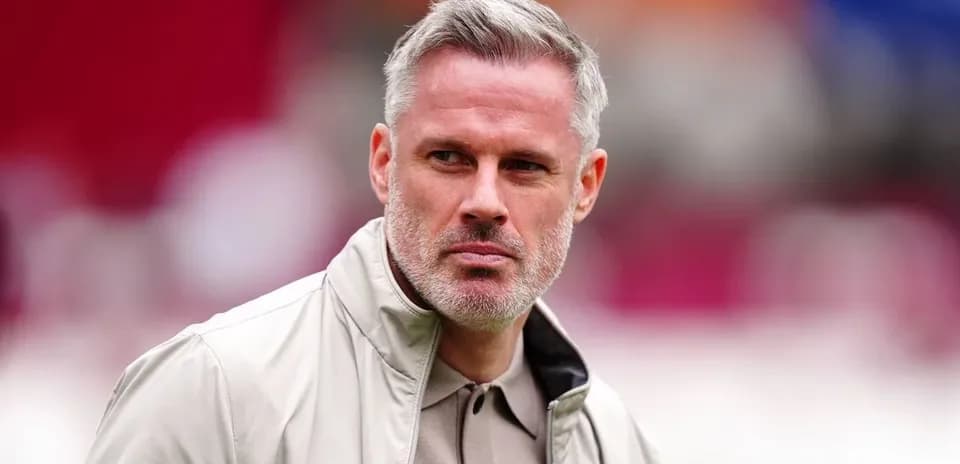 Man in beige jacket at sports venue