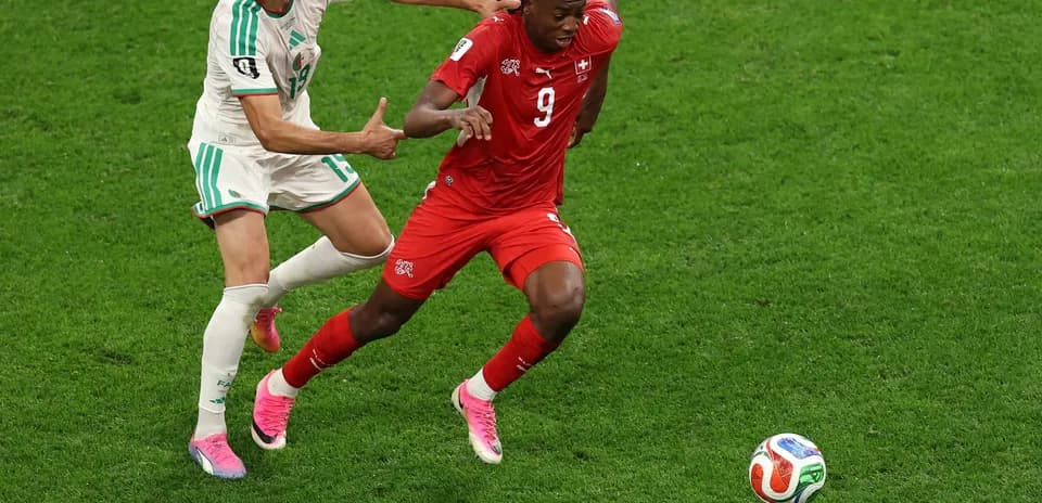 Player competing for the ball in match