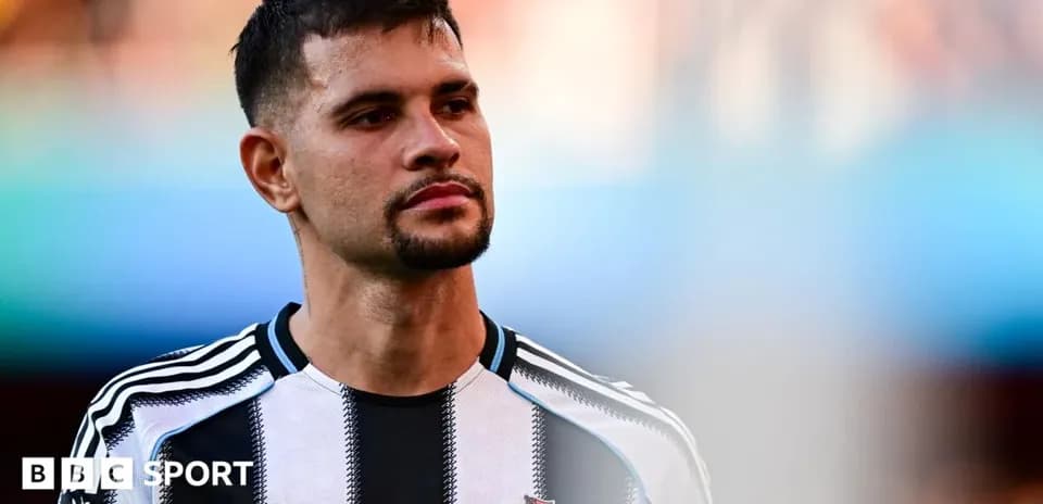 Newcastle player during match warm-up on pitch