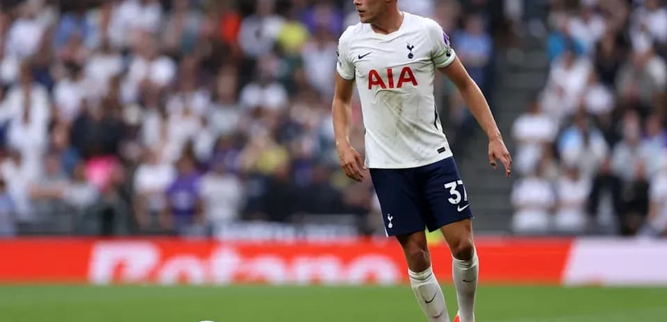Player in Tottenham kit during match on field