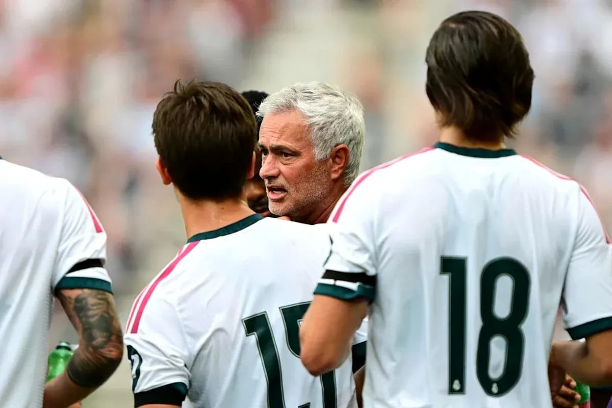 Coach discussing strategy with players during match