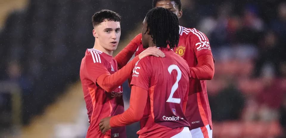 Manchester United players celebrating a goal together