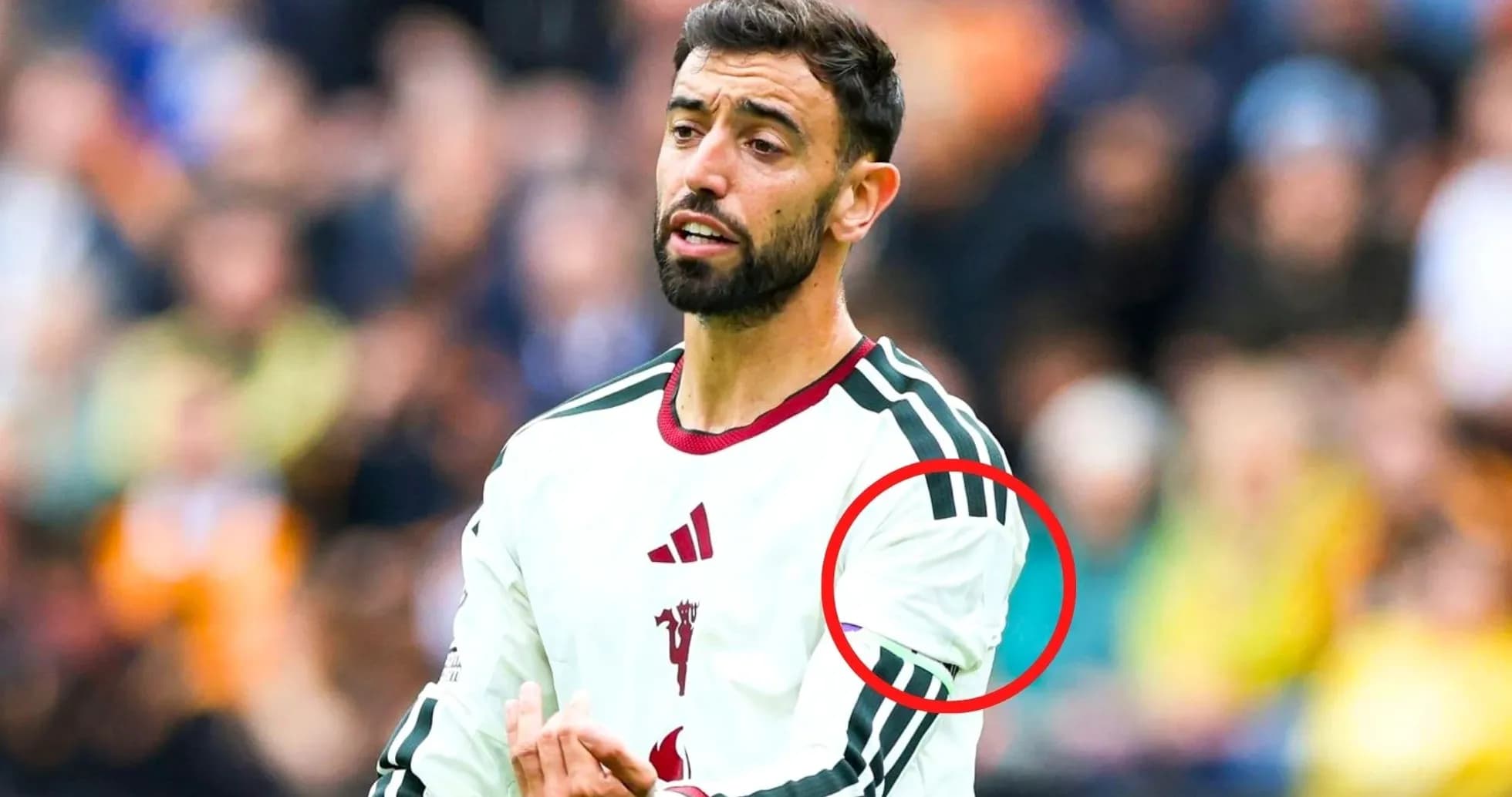 Player gesturing during match with team jersey