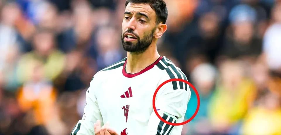 Player gesturing during match with team jersey