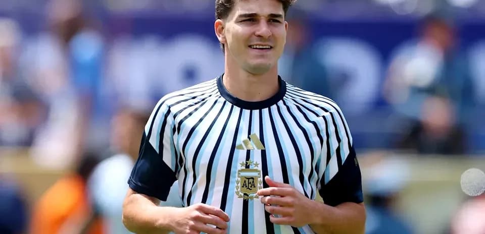 Player in striped jersey during match warm-up