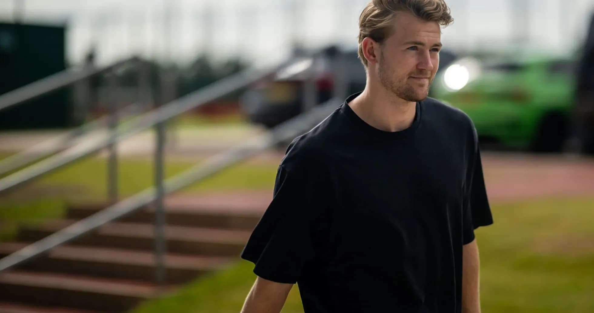 Player walking towards training facility entrance