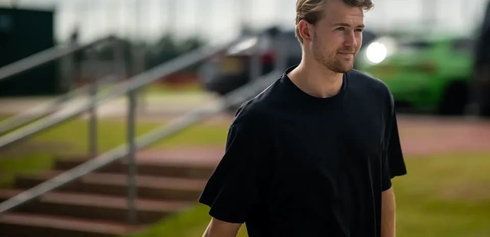Player walking towards training facility entrance