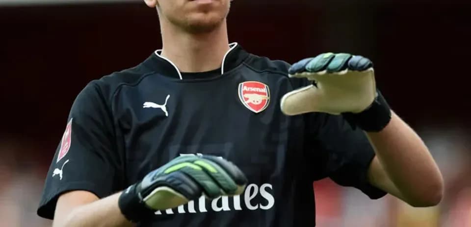Goalkeeper warming up on the pitch before match