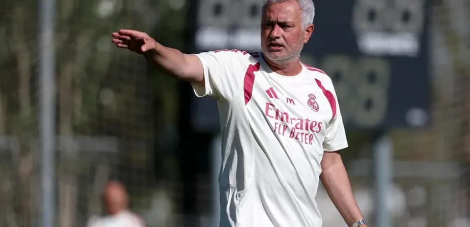Manager directing players during training session