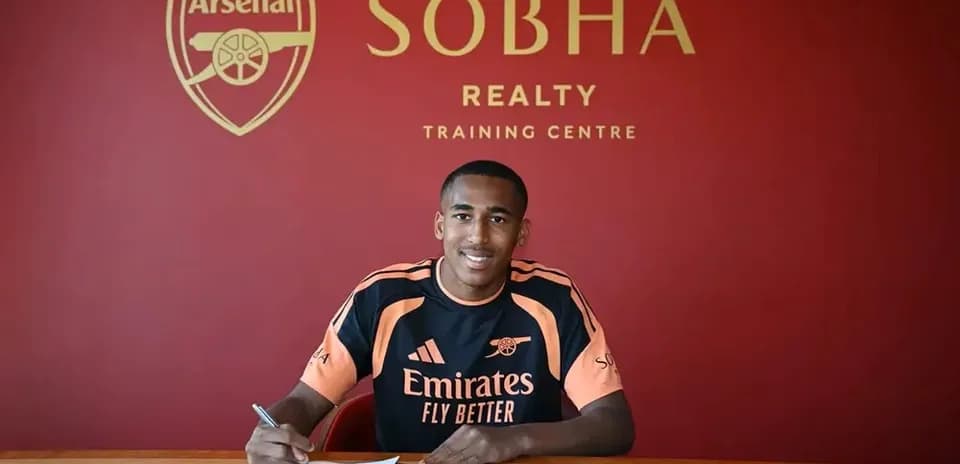 Player signing contract at Arsenal training centre