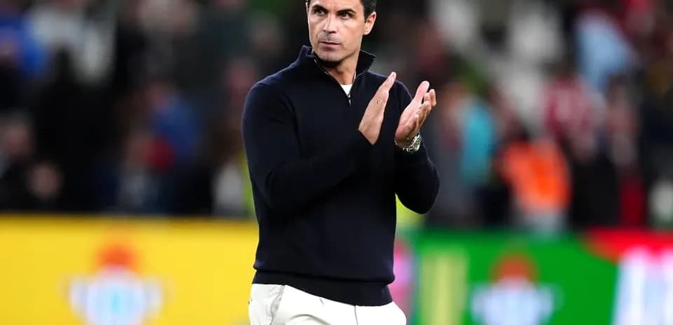 Coach applauding the crowd during a match