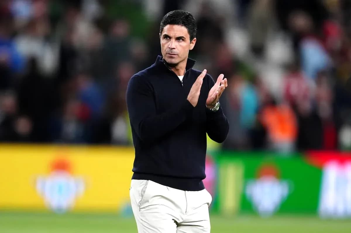 Coach applauding the crowd during a match